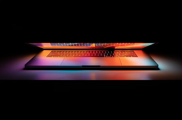 An open laptop in the dark