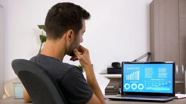 Investor Examining Charts