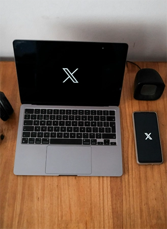 X on Laptop and Phone
