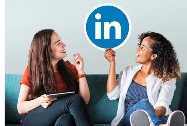 Image featuring LinkedIn employees holding LinkedIn icon 