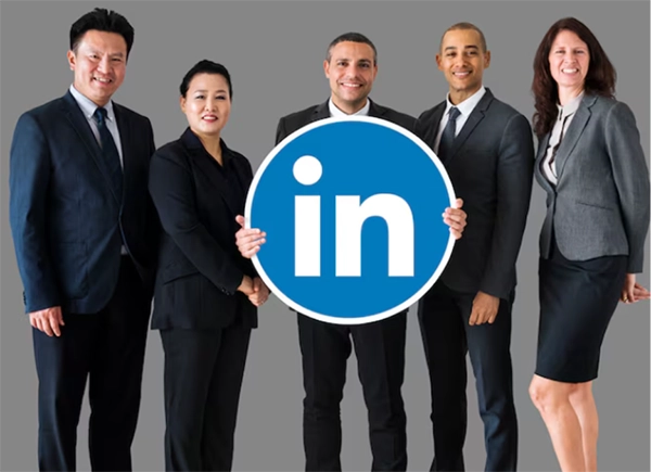 Image featuring LinkedIn employees holding LinkedIn icon in their hands