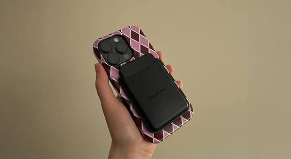 Image of Comulytic Note Pro magnetically attached to an iPhone.