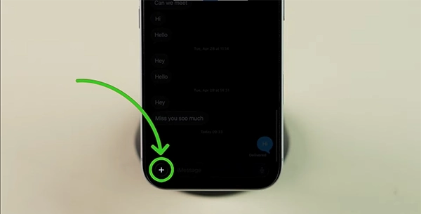 On the left side of the message bar, you will see a “+” icon; tap on it.