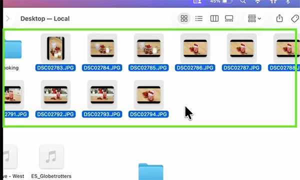 Select all the images by dragging the cursor over them.&nbsp;